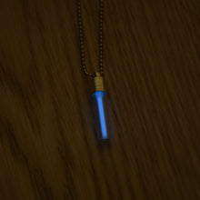 Load image into Gallery viewer, Tritium glow in the dark bright light blue necklace with a silver coloured cap and stainless steel ball chain.