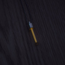 Load image into Gallery viewer, Tritium glow in the dark bright orange necklace with a silver coloured cap and stainless steel ball chain.