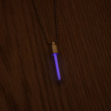 Load image into Gallery viewer, Tritium glow in the dark bright purple necklace with a silver coloured cap and stainless steel ball chain.