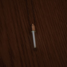 Load image into Gallery viewer, Tritium glow in the dark bright white necklace with a silver coloured cap and stainless steel ball chain.